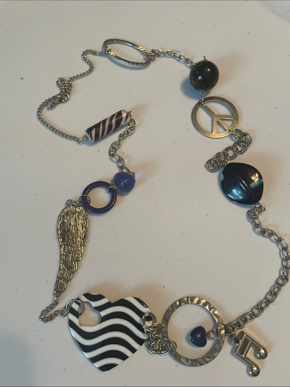 Handcrafted Silver-Tone Multi Charm Necklace with Black & Blue Accents